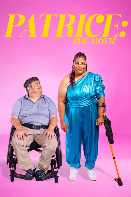 A Black disabled woman using an arm crutch stands next to her white partner, a man in a wheelchair. The background is bright pink.